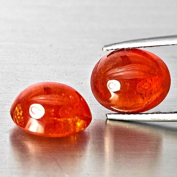 Natural Orangish Red Spessartine Garnet Gemstones 16.09 Ct. 2 Pcs. Oval Shape Cabochon: Product ID: 802938015 Product Name: Natural Garnet Weight: 16.09 CT. Size: 11.8 x 9.5 x 7.5 MM. Shape: Oval Cabochon Color: Orangish Red Clarity:SI1 Luster: Good Gems Origin: Namibia Treatment: Unheat