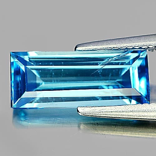 Natural Swiss Blue Topaz Gemstones 2.25 Ct. Baguette Shape 11.8 x 5 Mm.: Product ID: 807155262 Product Name: Natural Blue Topaz Weight: 2.25 CT. Size: 11.8 x 5 x 3.8 MM. Shape: Baguette Color: Swiss Blue Clarity:SI Luster: Good Gems Origin: Brazil Treatment: Treated Crysta