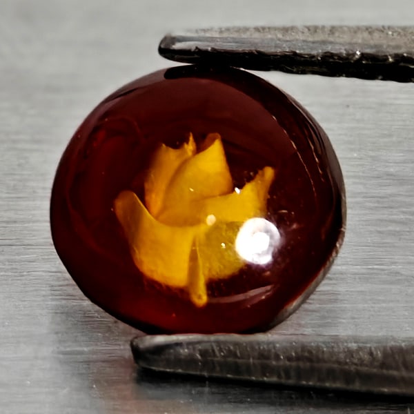 Natural Brown Yellow Amber 0.30 Ct. Flower Carving In Round Cabochon: Product ID: 819091080 Product Name: Natural Amber Weight: 0.30 CT. Size: 7 x 7 x 2.3 MM. Shape: Round Cabochon Color: Brown Yellow Clarity:Semi - Transparent Luster: Good Gems Origin: Poland Treatment