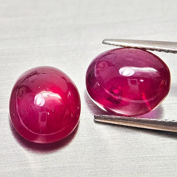 Natural Purplish Red Ruby Gemstones 8.80 Ct. 2 Pcs. Oval Shape Cabochon: Product ID: 805935256 Product Name: Natural Ruby Weight: 8.80 CT. Size: 10.2 x 8.3 x 5.3 to 10 x 8 x 5.1 MM. Shape: Oval Cabochon Color: Purplish Red Clarity:Semi - Transparent Luster: Good Gems Origi
