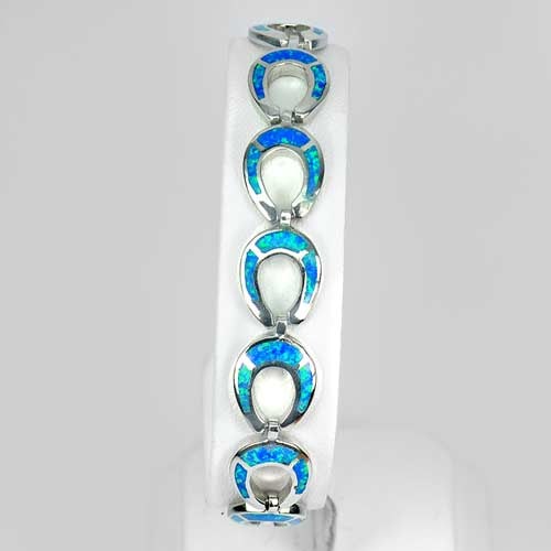 Multi Color Blue Created Opal 925 Sterling Silver Bracelet Horseshoe 7.5 Inch.: Product ID: 280160020 Product Type: 925 Sterling Silver Fine Jewelry Jewelry Weight: 17.23 Grams. Gemstones Color: Multi-Color Metal: Solid Silver 92.5%. Gemstone Detail: Average Range 17.23 - 17.62 G