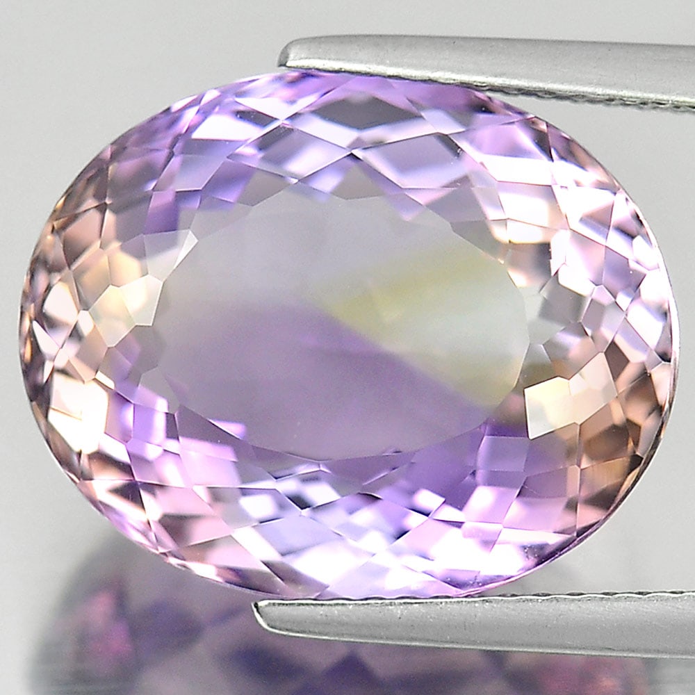 Natural Bi Color Ametrine Gemstones 13.36 Ct. Clean Oval Shape 17 x 13.6 Mm.: Product ID: 800408148 Product Name: Natural Ametrine Weight: 13.36 CT. Size: 17 x 13.6 x 9.5 MM. Shape: Oval Color: Bi-Color Clarity:IF Luster: Good Gems Origin: Bolivia Treatment: Unheated Crystal St