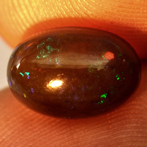 Natural Opal Multi-Color Gemstones 2.27 Ct. Oval Cabochon Shape 10.7 x 7.5 Mm.: Product ID: 818724698 Product Name: Natural Opal Weight: 2.27 CT. Size: 10.7 x 7.5 x 5.4 MM. Shape: Oval Cabochon Color: Multi-Color Clarity:Semi - Transparent Luster: Iridescent Gems Origin: Ethiopia