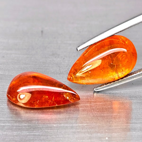 Natural Orangish Red Spessartine Garnet Gemstones 14.29 Ct. 2 Pcs. Pear Cabochon Shape 15.2 x 9.7: Product ID: 802938003 Product Name: Natural Garnet Weight: 14.29 CT. Size: 15.2 x 9.7 x 5.3 MM. Shape: Pear Cabochon Color: Orangish Red Clarity:SI1 Luster: Good Gems Origin: Namibia Treatment: Unheat