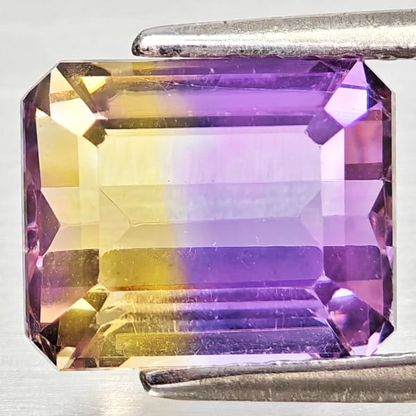 Natural Bi Color Ametrine Gemstones 2.43 Ct. Octagon Shape 8.5 x 7 Mm.: Product ID: 800408311 Product Name: Natural Ametrine Weight: 2.43 CT. Size: 8.5 x 7 x 5.4 MM. Shape: Octagon Color: Bi Color Clarity:VSI Luster: Good Gems Origin: Bolivia Treatment: Unheated Crystal S