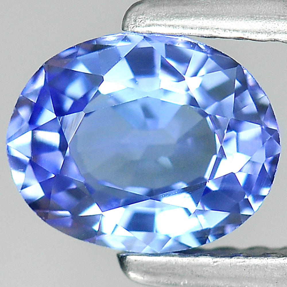 Natural Violetish Blue Tanzanite Gemstones 0.94 Ct. Clean Oval Shape 7 x 5.7 Mm.: Product ID: 807006519 Product Name: Natural Tanzanite Weight: 0.94 CT. Size: 7 x 5.7 x 3.4 MM. Shape: Oval Color: Blue Clarity:IF Luster: Good Gems Origin: Tanzania Treatment: Heated Crystal Structure