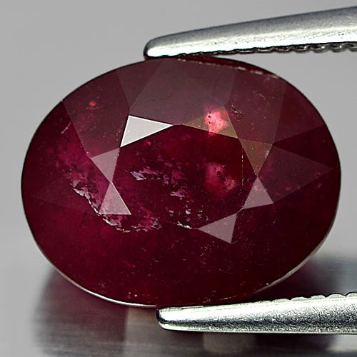 Natural Purplish Red Ruby Gemstones 4.94 Ct. Oval Shape 10.6 x 8.3 Mm.: Product ID: 805927408 Product Name: Natural Ruby Weight: 4.94 CT. Size: 10.6 x 8.3 x 5.5 MM. Shape: Oval Color: Red Clarity:SI1 Luster: Good Gems Origin: Madagascar Treatment: Heated Lead-glass fillin