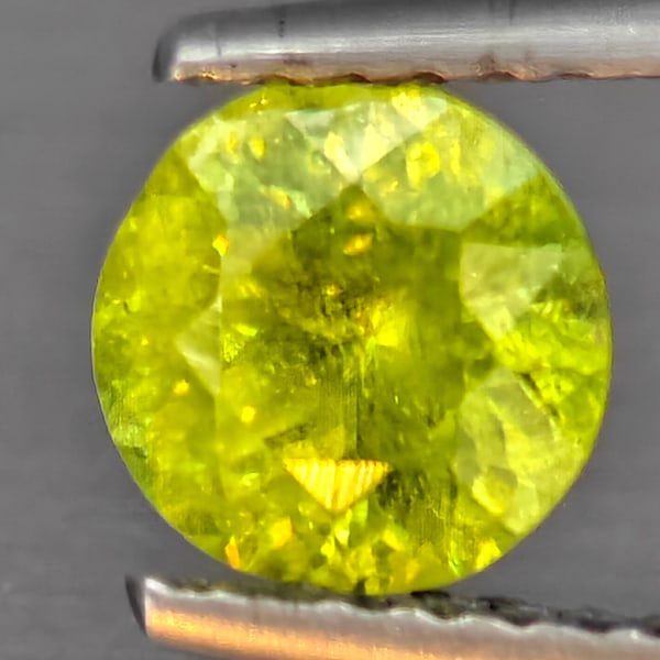 Natural Multi-Color With Rainbow Spark Sphene Gemstones 0.93 Ct. Round Shape 6.2 Mm.: Product ID: 806509290 Product Name: Natural Sphene Weight: 0.93 CT. Size: 6.2 x 6.2 x 4 MM. Shape: Round Shape Color: Multi-Color Clarity:SI1 Luster: Good Gems Origin: Madagascar Treatment: Unheated C