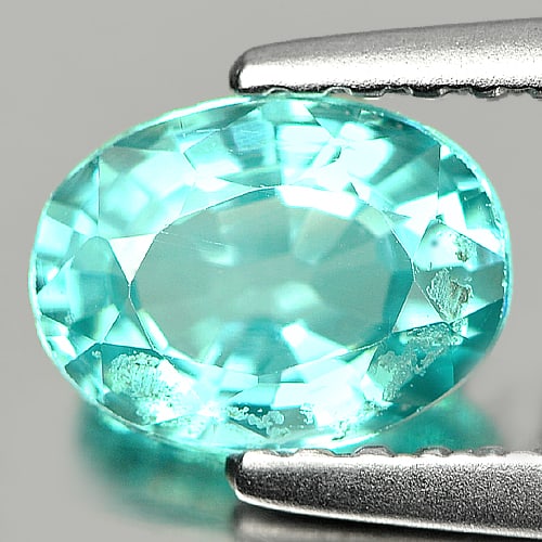 Natural Oval Paraiba Color Apatite Gemstones 0.84 Ct. Oval Shape 6.9 x 5.2 Mm.: Product ID: 800604039 Product Name: Natural Apatite Weight: 0.84 CT. Size: 6.9 x 5.2 x 3.4 MM. Shape: Oval Color: Neon Blue Clarity:SI Luster: Good Gems Origin: Tanzania Treatment: Unheated Crystal St