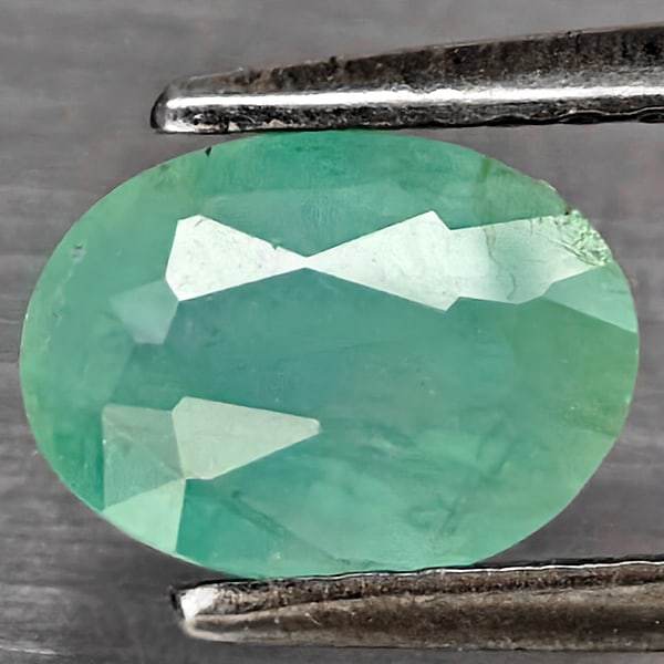 Natural Green Blueish Grandidierite Gemstones 1.31 Ct. Oval Shape 7.2 x 5.2 Mm.: Product ID: 803100110 Product Name: Natural Tsavorite Weight: 1.31 CT. Size: 7.2 x 5.2 x 3.8 MM. Shape: Oval Shape Color: Green Blueish Clarity:SI1 Luster: Good Gems Origin: Madagascar Treatment: Unhe