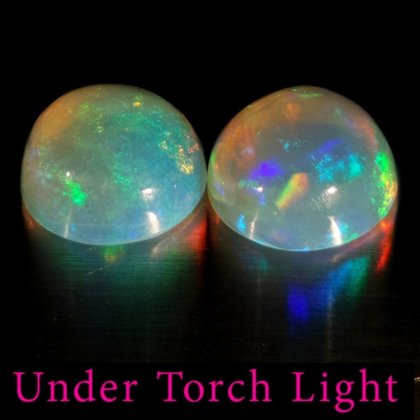 Natural Multi Color Opal Gemstones 1.95 Ct. 2 Pcs. Round Cabochon Shape 7.1 Mm.: Product ID: 818728274 Product Name: Natural Opal Weight: 1.95 CT. Size: 7.1 x 7.1 x 3.8 MM. Shape: Round Color: Multi-Color Clarity:Semi - Transparent Luster: Good Gems Origin: Ethiopia Treatment: Unh