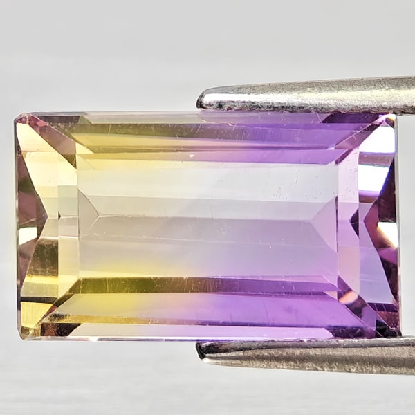 Natural Bi Color Ametrine Gemstones 2.96 Ct. Octagon Shape 11.2 x 6.8 Mm.: Product ID: 800408408 Product Name: Natural Ametrine Weight: 2.96 CT. Size: 11.2 x 6.8 x 5 MM. Shape: Octagon Color: Bi Color Clarity:VSI - SI1 Luster: Good Gems Origin: Bolivia Treatment: Unheated Cr