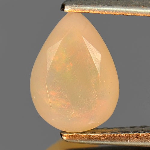 Natural Multi Color Play Of Colour Opal Gemstones 0.85 Ct. Pear Shape 9.8 x 7 Mm.: Product ID: 818726151 Product Name: Natural Opal Weight: 0.85 CT. Size: 9.8 x 7 x 3.8 MM. Shape: Pear Color: Multi Color Clarity:Semi - Transparent Luster: Iridescent Gems Origin: Ethiopia Treatment: 