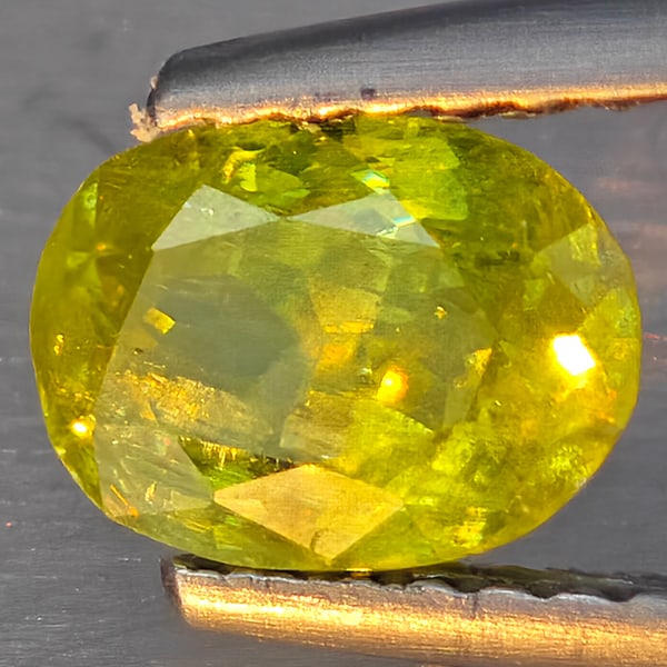 Natural Multi-Color With Rainbow Spark Sphene Gemstones 1.11 Ct. Oval Shape 7 x 5.2 Mm.: Product ID: 806509238 Product Name: Natural Sphene Weight: 1.11 CT. Size: 7 x 5.2 x 3.9 MM. Shape: Oval Shape Color: Multi-Color Clarity:SI1 Luster: Good Gems Origin: Madagascar Treatment: Unheated Cr