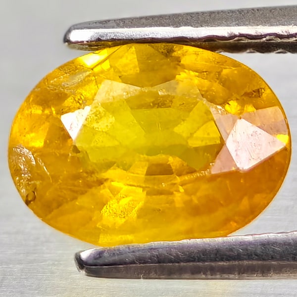 Natural Yellow Sapphire Gemstones 1.42 Ct. Oval Shape 7.9 x 6 Mm.: Product ID: 806162597 Product Name: Natural Yellow Sapphire Weight: 1.42 CT. Size: 7.9 x 6 x 3.5 MM. Shape: Oval Color: Yellow Clarity:VSI - SI1 Luster: Good Gems Origin: Thailand Treatment: Heated Cr