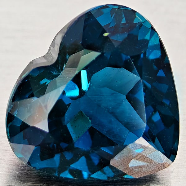 Natural London Blue Topaz Gemstones 4.76 Ct. Heart Shape 10 x 9.2 Mm.: Product ID: 807168368 Product Name: Natural Blue Topaz Weight: 4.76 CT. Size: 10 x 9.2 x 7.2 MM. Shape: Heart Shape Color: London Blue Clarity:VVS - VSI Luster: Good Gems Origin: Brazil Treatment: Tre