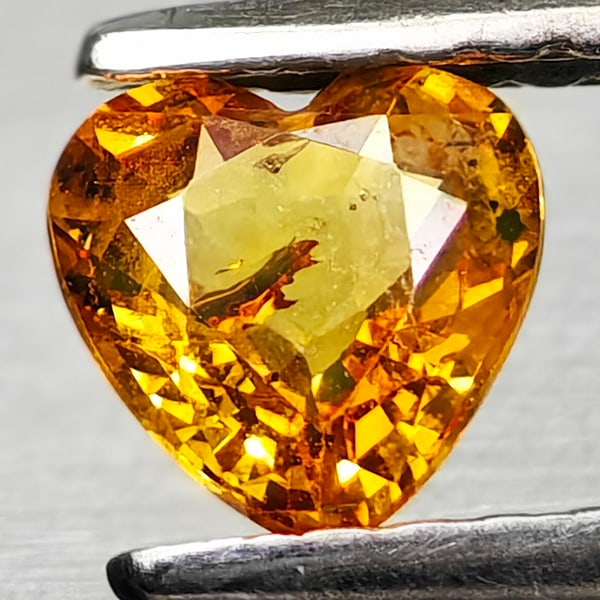 Natural Yellow Songea Sapphire Gemstones 0.56 Ct. Heart Shape 5.1 x 5 Mm.: Product ID: 806162450 Product Name: Natural Yellow Sapphire Weight: 0.56 CT. Size: 5.1 x 5 x 2.6 MM. Shape: Heart Shape Color: Yellow Clarity:VSI - SI1 Luster: Good Gems Origin: Tanzania Treatment: He