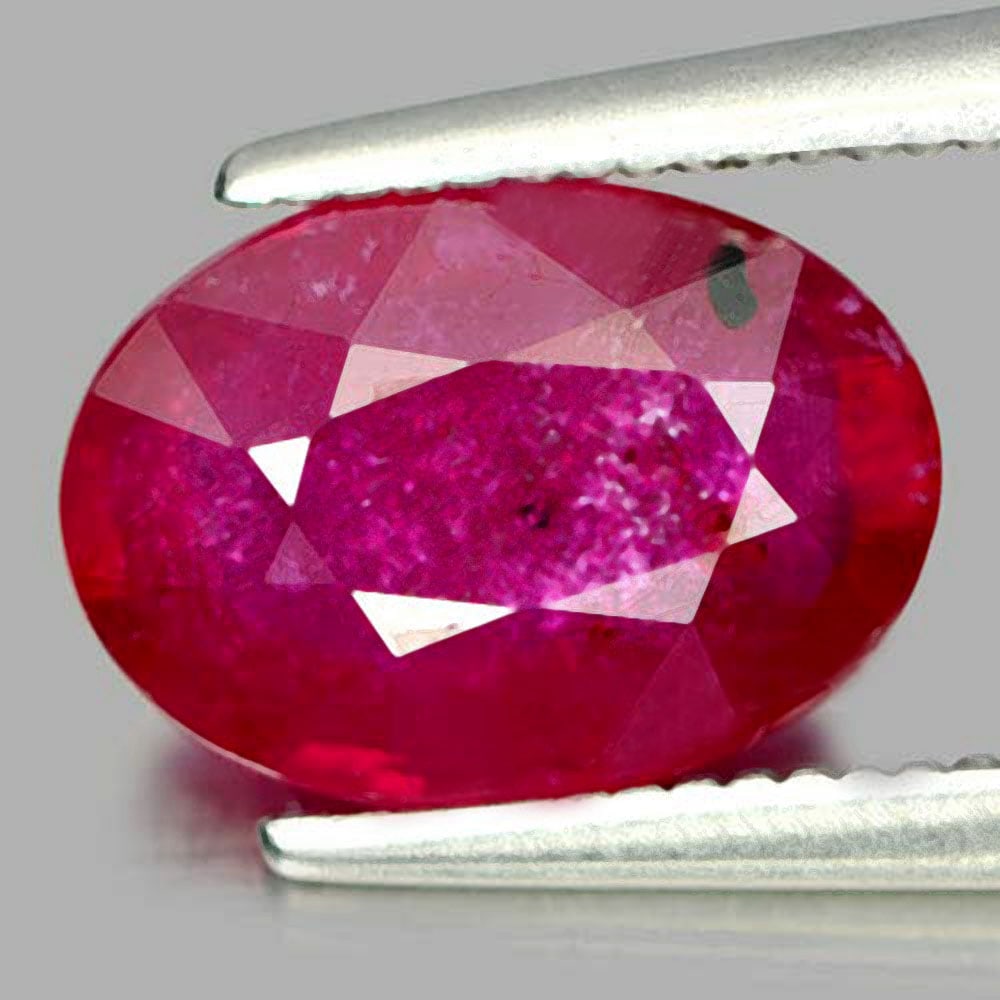 Natural Purplish Red Ruby Gemstones 2.31 Ct. Oval Shape 9.5 x 6.8 Mm.: Product ID: 805927503 Product Name: Natural Ruby Weight: 2.31 CT. Size: 9.5 x 6.8 x 3.7 MM. Shape: Oval Color: Red Clarity:VSI Luster: Good Gems Origin: Madagascar Treatment: Heated Lead-glass filling