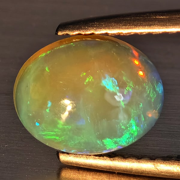 Natural Multi-Color Play Of Colour Opal Gemstone 1.41 Ct. Oval Cabochon Shape 9.2 x 7.3 Mm (1 of 3)