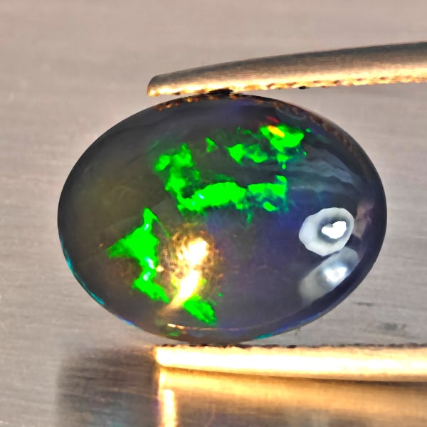 Natural Multi Color Play Of Colour Opal Gemstones 2.03 Ct. Oval Cabochon Shape 12.2 x 9.4 Mm.: Product ID: 818728607 Product Name: Natural Opal Weight: 2.03 CT. Size: 12.2 x 9.4 x 4 MM. Shape: Oval Cabochon Shape Color: Multi-Color Clarity:Semi - Transparent Luster: Good Gems Origin: Ethiopia T