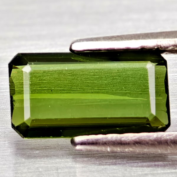 Natural Green Tourmaline Gemstones 0.81 Ct. Octgon Shape 8.7 x 4.8 Mm.: Product ID: 807250907 Product Name: Natural Tourmaline Weight: 0.81 CT. Size: 8.7 x 4.8 x 2.1 MM. Shape: Octagon Color: Green Clarity:VSI Luster: Good Gems Origin: Nigeria Treatment: Unheated Crystal 