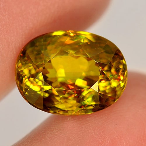 Natural Multi Color Sphene Gemstones 6.76 Ct. Oval Shape 12.6 x 9.5 Mm. (1 of 3)