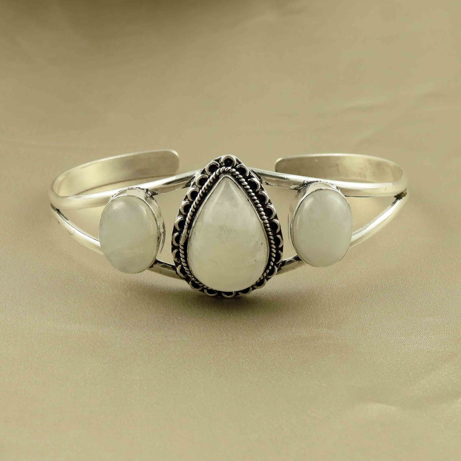 Natural Rainbow Moonstone Silver Plated Handmade Cuff Bangle: Product ID: 260524153442 Product - Handmade Silver Plated Cuff Bangle Metal - 92.5 Sterling Silver Plated Bangle Size - 7.5x5.5 CM (Adjustable) Gemstone - Rainbow Moonstone Gemstone Origin - India Gem