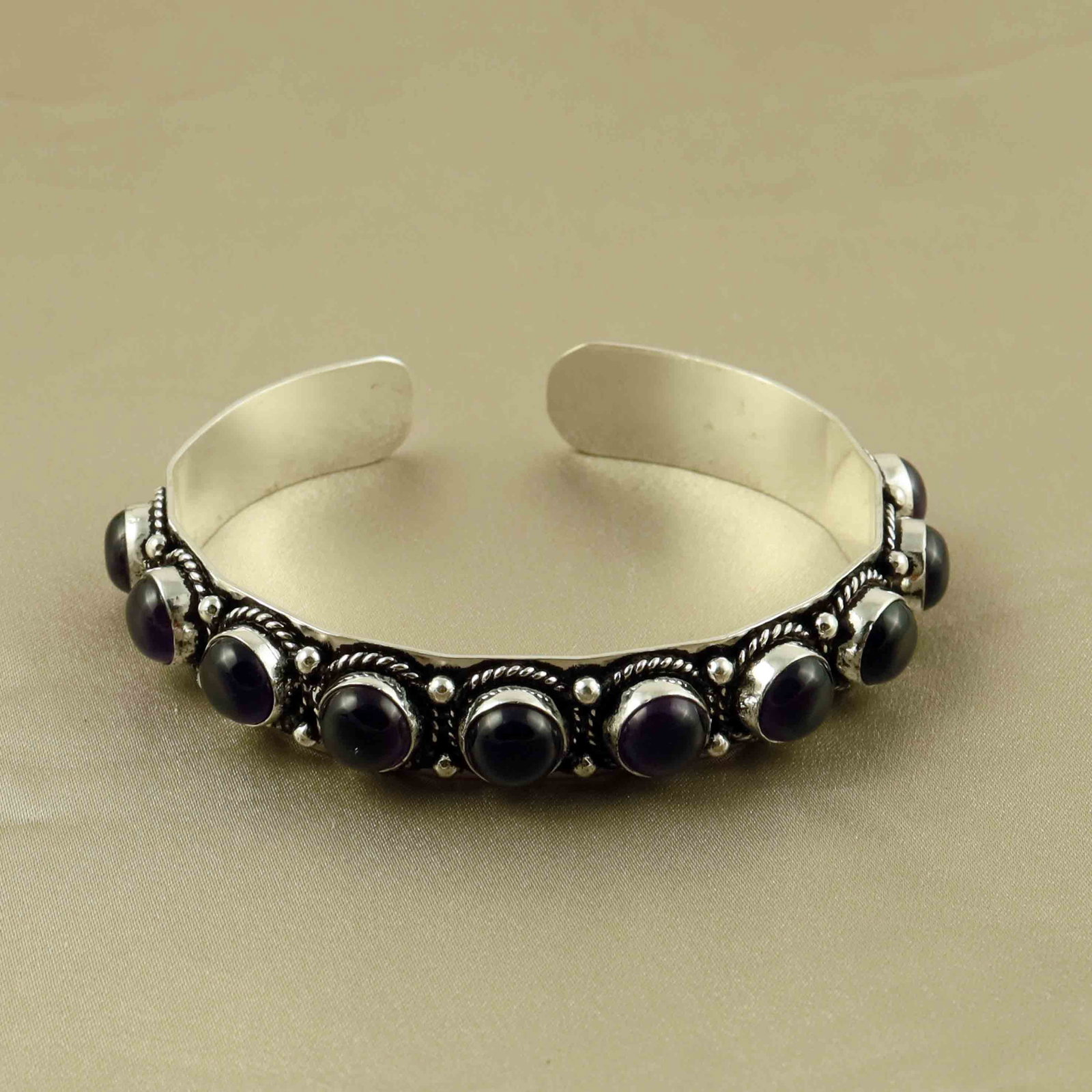 Natural Amethyst Sterling Silver Plated Handmade Cuff Bangle: Product ID: 260607171517 Product - Handmade Silver Plated Cuff Bangle Metal - 92.5 Sterling Silver Plated Bangle Size - 6x5.5 CM (Adjustable) Gemstone - Amethyst Gemstone Origin - Brazil Gemstone Size