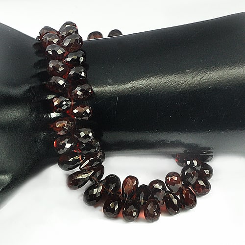 Natural Red Garnet Gemstones 187.55 Ct. Briolette Shape 7.6 x 5.5 Mm. Length 9 Inch.: Product ID: 802918345 Product Name: Natural Garnet Weight: 187.55 CT. Size: 9 Inch / 7.6 x 5.5 x 5.5 MM. Shape: Briolette Color: Red Clarity:VVS Luster: Good Gems Origin: Nigeria Treatment: Unheated C