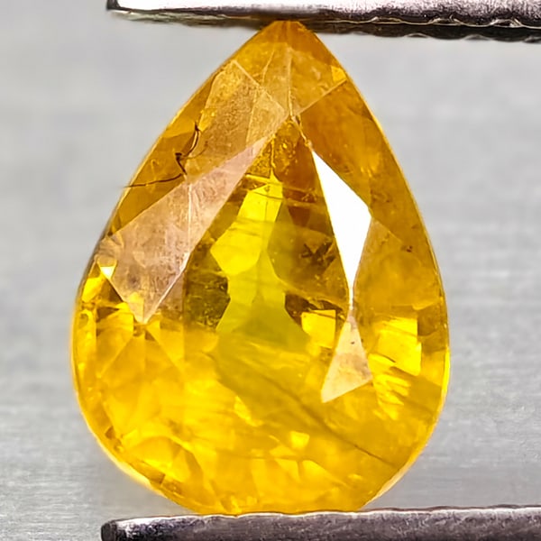 Natural Yellow Sapphire Gemstones 1.09 Ct. Pear Shape 7.3 x 5.3 Mm.: Product ID: 806162570 Product Name: Natural Yellow Sapphire Weight: 1.09 CT. Size: 7.3 x 5.3 x 3.5 MM. Shape: Pear Shape Color: Yellow Clarity:VSI - SI1 Luster: Good Gems Origin: Thailand Treatment: T