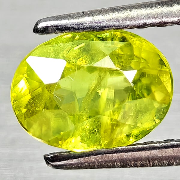 Natural Intense Yellow Green Sphene Gemstones Red Spark 1.01 Ct. Oval Shape 6.8 x 5.1 Mm.: Product ID: 806509054 Product Name: Natural Sphene Weight: 1.01 CT. Size: 6.8 x 5.1 x 3.6 MM. Shape: Oval Color: Intense Yellow Green With Red Spark Clarity:SI1 Luster: Good Gems Origin: Madagascar Tr