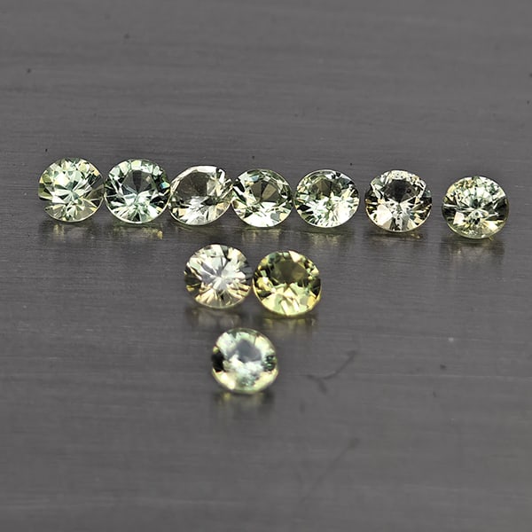 Natural Green Songea Sapphire Gemstones 0.68 Ct. 10 Pcs. Round Diamond Cut 2.6 Mm.: Product ID: 806130511 Product Name: Natural Blue Sapphire Weight: 0.68 CT. Size: 2.6 x 2.6 x 1.6 MM. Shape: Round Diamond Cut Color: Green Clarity:SI1 Luster: Good Gems Origin: Tanzania Treatment: Hea