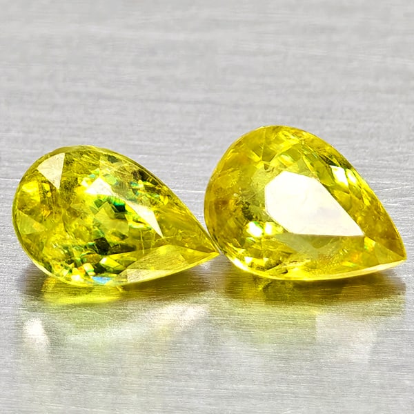 Natural Yellowish Green Sphene Gemstones With Rainbow Spark 1.30 Ct. 2 Pcs. Pear Shape 6.3 x 4.1 Mm.: Product ID: 806509058 Product Name: Natural Sphene Weight: 1.30 CT. Size: 6.3 x 4.1 x 3.5 MM. Shape: Pear Shape Color: Yellowish Green With Rainbow Spark Clarity:SI1 Luster: Good Gems Origin: Madagasc