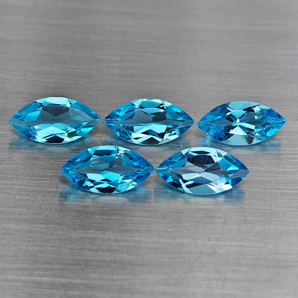 Natural Swiss Blue Topaz Gemstones 5.68 Ct. 5 Pcs. Marquise Shape 10 x 5.1 Mm.: Product ID: 807168700 Product Name: Natural Blue Topaz Weight: 5.68 CT. Size: 10 x 5.1 x 4 MM. Shape: Marquise Shape Color: Swiss Blue Clarity:VSI Luster: Good Gems Origin: Brazil Treatment: Treated C