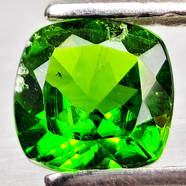 Natural Green Chrome Diopside Gemstones 0.54 Ct. Cushion Shape 5.2 Mm.: Product ID: 801608203 Product Name: Natural Chrome Diopside Weight: 0.54 CT. Size: 5.2 x 5.2 x 2.7 MM. Shape: Cushion Shape Color: Green Clarity:VSI - SI1 Luster: Good Gems Origin: Russia Treatment: U