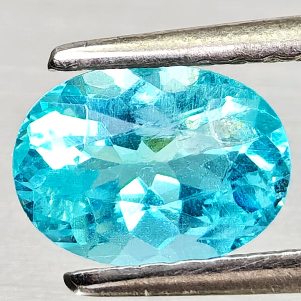 Natural Paraiba Color Apatite Gemstones 0.90 Ct. Oval Shape 7.1 x 5.2 Mm.: Product ID: 800613700 Product Name: Natural Apatite Weight: 0.90 CT. Size: 7.1 x 5.2 x 3.7 MM. Shape: Oval Color: Neon Blue Clarity:VSI Luster: Good Gems Origin: Tanzania Treatment: Unheated Crystal S