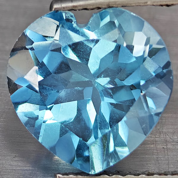 Natural Baby Blue Topaz Gemstones 5.75 Ct. Heart Shape 10.9 Mm.: Product ID: 807168733 Product Name: Natural Blue Topaz Weight: 5.75 CT. Size: 10.9 x 10.9 x 6.9 MM. Shape: Heart Shape Color: Baby Blue Clarity:VSI Luster: Good Gems Origin: Brazil Treatment: Treated 
