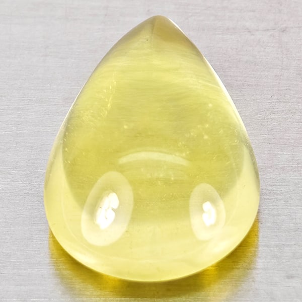 Natural Yellow Lemon Quartz Gemstones 11.04 Ct. Pear Cabochon Shape 18.4 x 12.5 Mm.: Product ID: 805530075 Product Name: Natural Quartz Weight: 11.04 CT. Size: 18.4 x 12.5 x 7.9 MM. Shape: Pear Cabochon Color: Yellow Clarity:None Luster: Good Gems Origin: Brazil Treatment: Unheated Cr