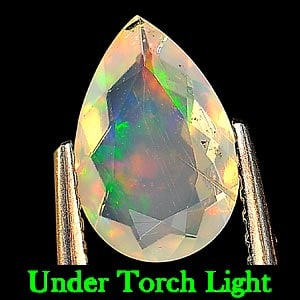 Natural Multi Color Opal Gemstones 0.67 Ct. Pear Shape 9.2 x 6.2 Mm.: Product ID: 818718775 Product Name: Natural Opal Weight: 0.67 CT. Size: 9.2 x 6.2 x 2.9 MM. Shape: Pear Color: Multi Color Clarity:Semi - Transparent Luster: Good Gems Origin: Ethiopia Treatment: Unhe