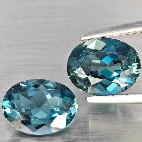 Natural London Blue Topaz Gemstones 4.05 Ct. 2 Pcs. Oval Shape 9.1 x 7.4 Mm.: Product ID: 807168908 Product Name: Natural Blue Topaz Weight: 4.05 CT. Size: 9.1 x 7.4 x 4.9 MM. Shape: Oval Color: London Blue Clarity:SI1 Luster: Good Gems Origin: Brazil Treatment: Treated Crystal