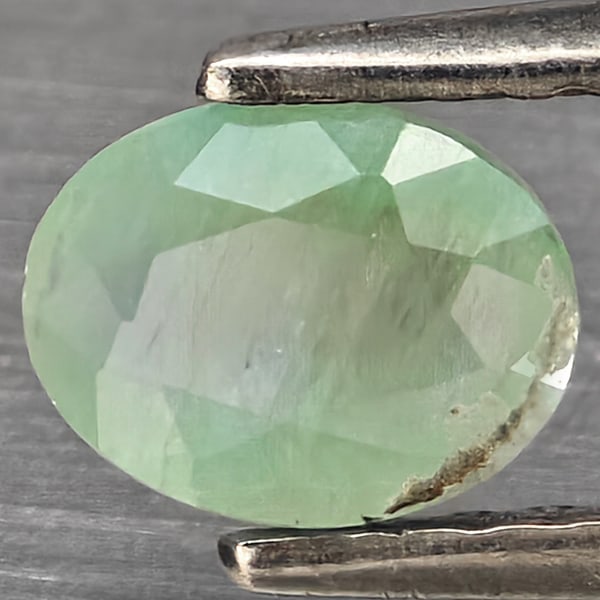 Natural Green Blueish Grandidierite Gemstones 1.07 Ct. Oval Shape 6.3 x 4.8 Mm.: Product ID: 803100103 Product Name: Natural Tsavorite Weight: 1.07 CT. Size: 6.3 x 4.8 x 3.5 MM. Shape: Oval Shape Color: Green Blueish Clarity:SI1 Luster: Good Gems Origin: Madagascar Treatment: Unhe