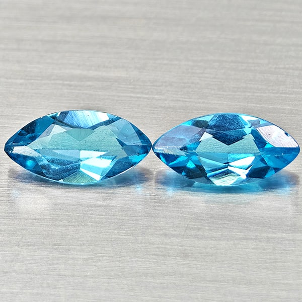 Natural Swiss Blue Topaz Gemstoes 2.53 Ct. 2 Pcs Marquise Shape 10.1 x 5 Mm.: Product ID: 807168197 Product Name: Natural Blue Topaz Weight: 2.53 CT. Size: 10.1 x 5 x 3.5 MM. Shape: Marquise Shape Color: Swiss Blue Clarity:VSI Luster: Good Gems Origin: Brazil Treatment: Treated