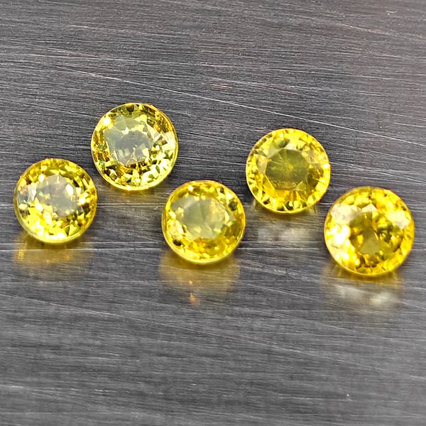 Natural Greenish Yellow Sphene Gemstones Rainbow Spark 1.15 Ct. 5 Pcs. Round Shape 3.4 Mm.: Product ID: 806509392 Product Name: Natural Sphene Weight: 1.15 CT. Size: 3.4 x 3.4 x 2.5 MM. Shape: Round Color: Greenish Yellow Clarity:SI1 Luster: Good Gems Origin: Madagascar Treatment: Unheated C