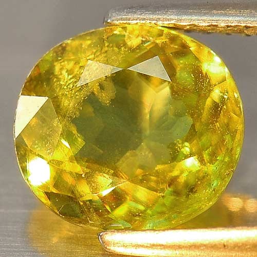 Natural Multi Color Sphene Gemstones Rainbow Green Spark 3.09 Ct. Oval Shape 9.7 x 9 Mm.: Product ID: 806503335 Product Name: Natural Sphene Weight: 3.09 CT. Size: 9.7 x 9 x 4.6 MM. Shape: Oval Color: Multi Color With Red Spark Clarity:SI Luster: Adamantine Gems Origin: Mardagascar Treatme