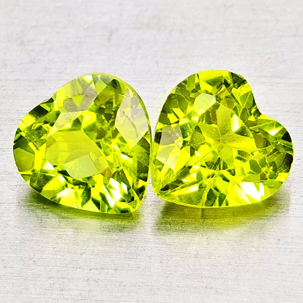 Natural Green Peridot Gemstones 1.79 Ct. 2 Pcs. Heart Shape 6 x 6 Mm.: Product ID: 805317310 Product Name: Natural Peridot Weight: 1.79 CT. Size: 6 x 6 x 3.9 MM. Shape: Heart Shape Color: Green Clarity:VSI Luster: Very Good Gems Origin: Pakistan Treatment: Unheated Cryst