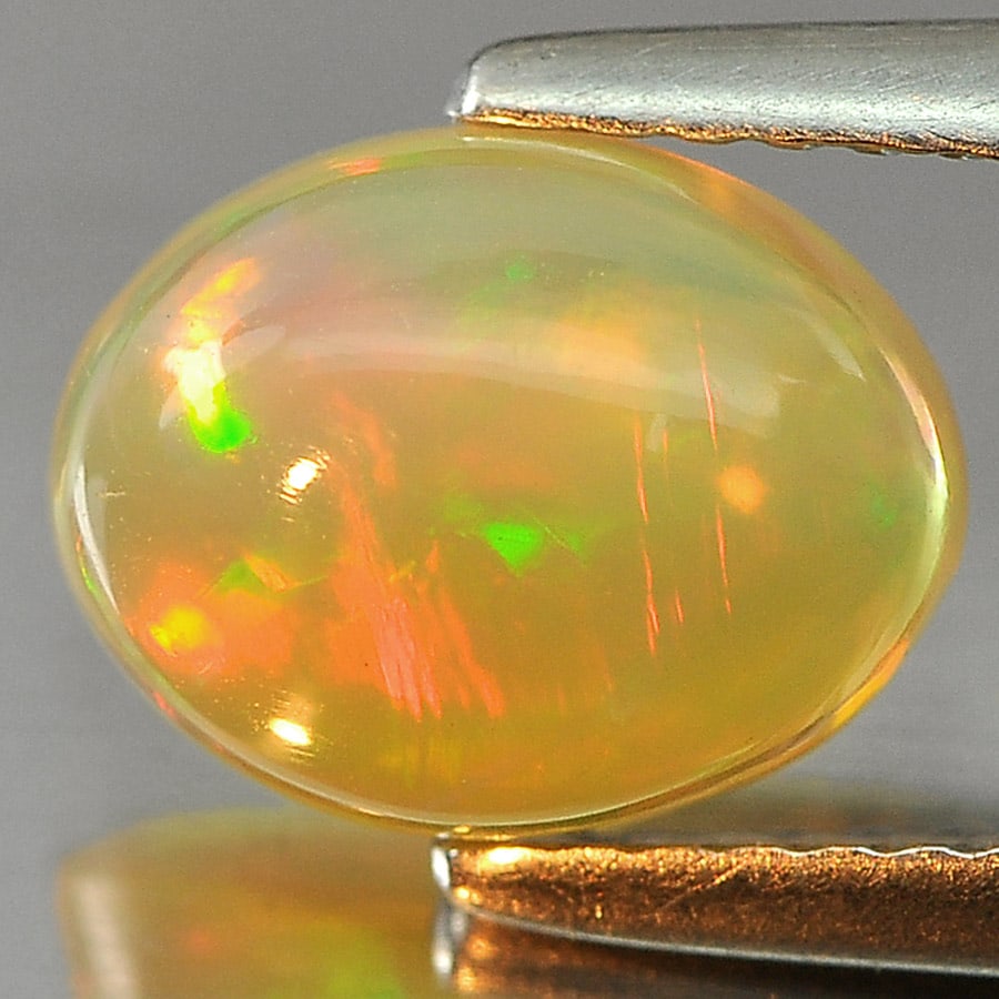 Natural Multi Color Opal Gemstones 1.20 Ct. Oval Cabochon Shape 9.2 x 7.2 Mm.: Product ID: 818727058 Product Name: Natural Opal Weight: 1.20 CT. Size: 9.2 x 7.2 x 4 MM. Shape: Oval Cabochon Color: Multi-Color Clarity:Semi - Transparent Luster: Iridescent Gems Origin: Ethiopia Tr