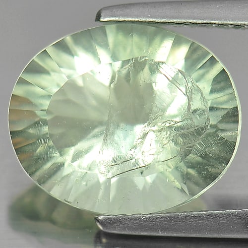 Natural Green Fluorite Gemstones 5.26 Ct. Oval Concave Cut 12 x 10 Mm.: Product ID: 802704868 Product Name: Natural Fluorite Weight: 5.26 CT. Size: 12 x 10 x 7 MM. Shape: Oval Concave Cut Color: Green Clarity:SI Luster: Good Gems Origin: Brazil Treatment: Unheated Crystal