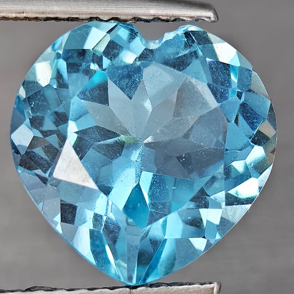 Natural Baby Blue Topaz Gemstones 6.23 Ct. Heart Shape 11.2 Mm.: Product ID: 807168772 Product Name: Natural Blue Topaz Weight: 6.23 CT. Size: 11.2 x 11.2 x 7.2 MM. Shape: Heart Shape Color: Baby Blue Clarity:VSI Luster: Good Gems Origin: Brazil Treatment: Treated 