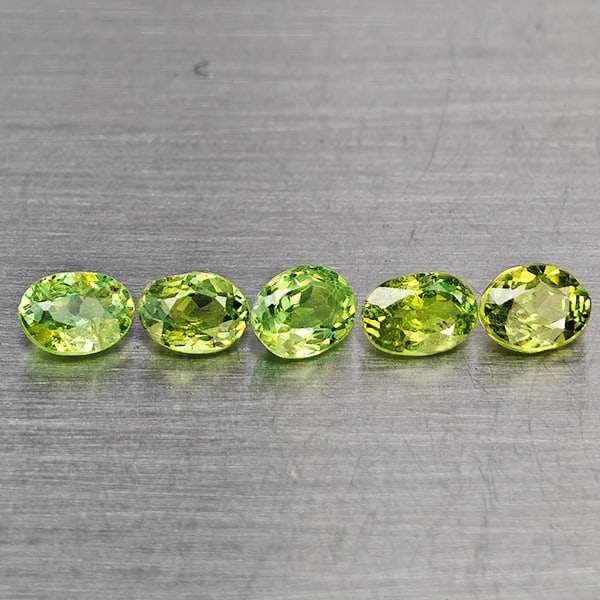 Natural Green Demantiod Garnet Gemstones 1.07 Ct. 5 Pcs. Oval Shape 4 x 3 Mm.: Product ID: 802937602 Product Name: Natural Demantoid Weight: 1.07 CT. Size: 4 x 3 x 2 MM. Shape: Oval Shape Color: Green Clarity:VSI Luster: Good Gems Origin: Madagascar Treatment: Unheated Crystal S