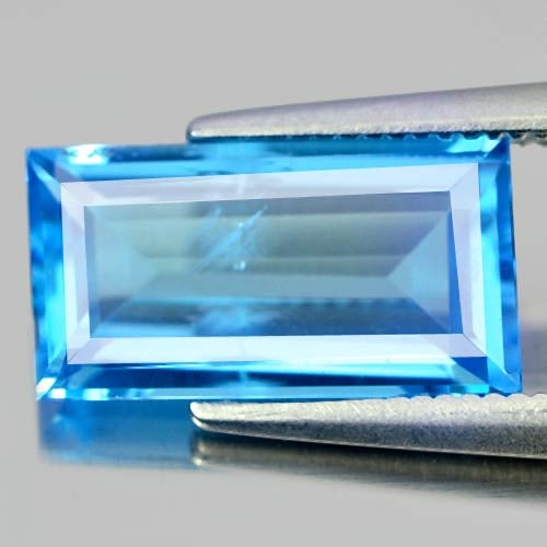 Natural Swiss Blue Topaz Gemstones 3.12 Ct. Baguette Shape 12 x 6.6 Mm.: Product ID: 807155257 Product Name: Natural Blue Topaz Weight: 3.12 CT. Size: 12 x 6.6 x 3.8 MM. Shape: Baguette Color: Swiss Blue Clarity:SI Luster: Good Gems Origin: Brazil Treatment: Treated Crysta